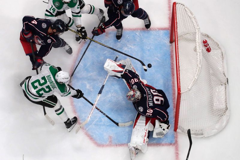 Feb 25, 2025; Columbus, Ohio, USA; Dallas Stars right wing Matej Blumel (22) flips the puck past Columbus Blue Jackets goalie Elvis Merzlikins (90) for a goal during the third period at Nationwide Arena. Mandatory Credit: Russell LaBounty-Imagn Images