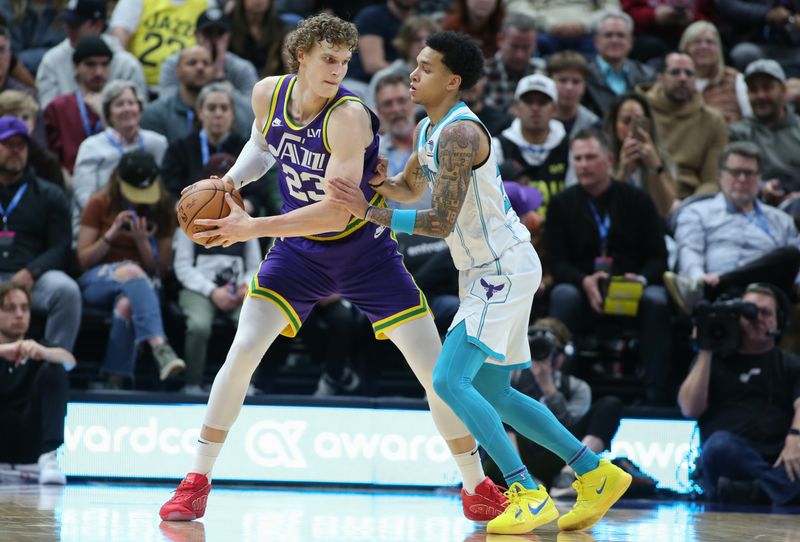 SALT LAKE CITY, UT - FEBRUARY 22: Lauri Markkanen #23 of the Utah Jazz works against Tre Mann #23 of the Charlotte Hornets during the second half of their game at the Delta Center on February 22, 2024 in Salt Lake City, Utah.  NOTE TO USER: User expressly acknowledges and agrees that, by downloading and or using this Photograph, User is concenting to the terms and conditions of the Getty Images license Agreement. (Photo by Chris Gardner/Getty Images)