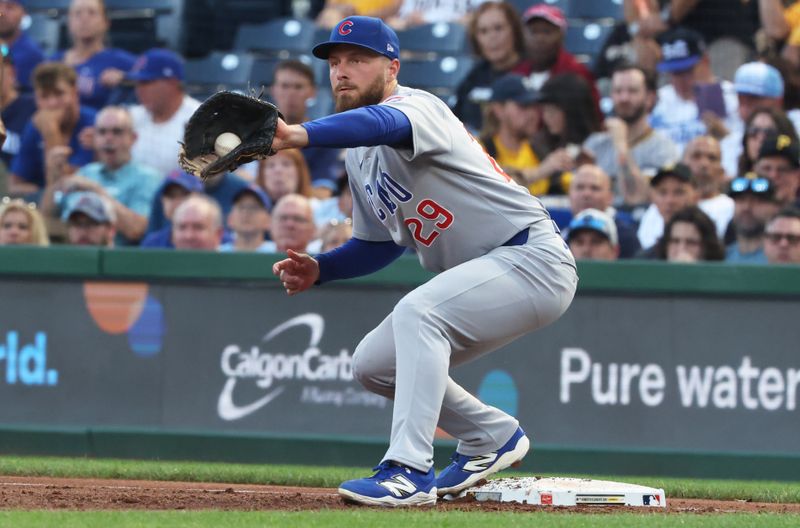 Sep 15, 2025; Pittsburgh, Pennsylvania, USA;  Chicago Cubs first baseman Michael Busch (29) takes a throw at first base to retire Pittsburgh Pirates third baseman Jared Triolo (not pictured) during the first inning at PNC Park. Mandatory Credit: Charles LeClaire-Imagn Images