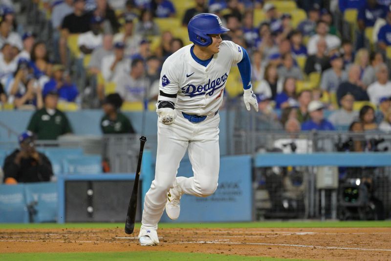 Aug 23, 2024; Los Angeles, California, USA;  Los Angeles Dodgers designated hitter Shohei Ohtani (17) singles in the fourth inning against the Tampa Bay Rays at Dodger Stadium. Mandatory Credit: Jayne Kamin-Oncea-USA TODAY Sports