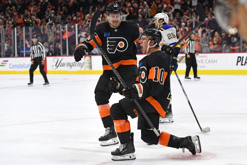 Oct 31, 2024; Philadelphia, Pennsylvania, USA; Philadelphia Flyers right wing Bobby Brink (10) celebrates his goal with defenseman Rasmus Ristolainen (55) against the St. Louis Blues during the third period at Wells Fargo Center. Mandatory Credit: Eric Hartline-Imagn Images