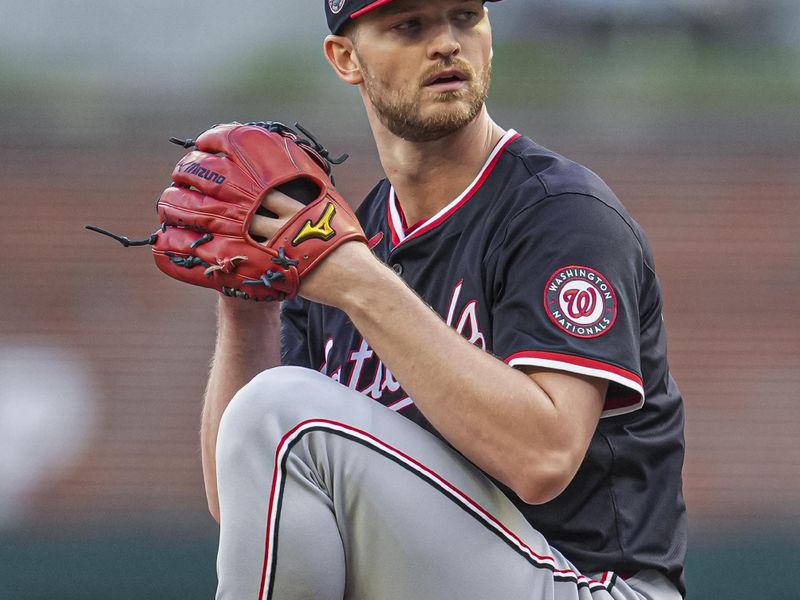 May 13, 2025; Cumberland, Georgia, USA; Washington Nationals starting pitcher Michael Soroka (34) pitches against the Atlanta Braves during the first inning at Truist Park. Mandatory Credit: Dale Zanine-Imagn Images