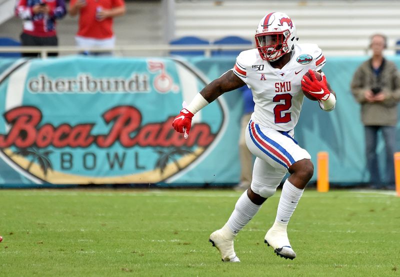 Dec 21, 2019; Boca Raton, Florida, USA; Southern Methodist Mustangs running back Ke'Mon Freeman (2) carries the ball against the Florida Atlantic Owls during the Cheribundi Boca Raton Bowl at FAU Stadium. Mandatory Credit: Steve Mitchell-USA TODAY Sports