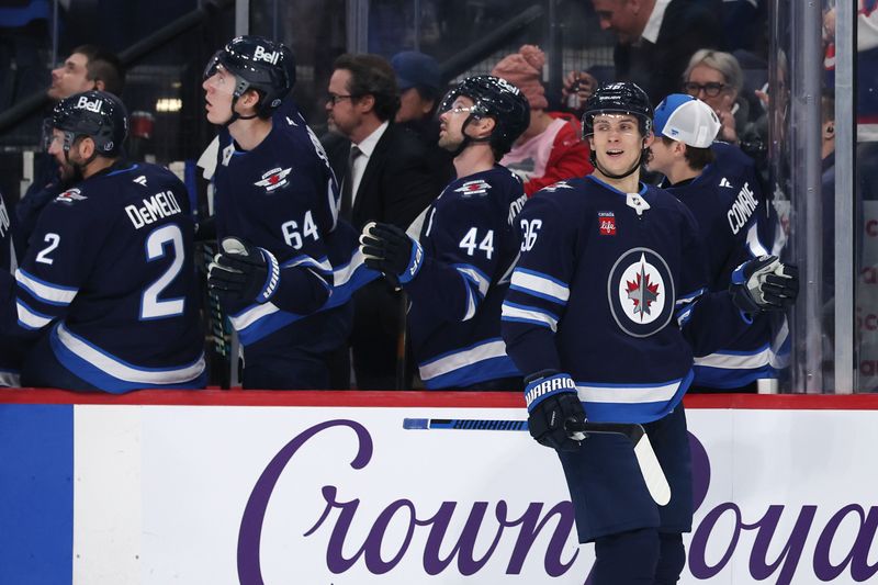 Jan 7, 2025; Winnipeg, Manitoba, CAN; Winnipeg Jets center Morgan Barron (36) celebrates his first period goal against the Nashville Predators at Canada Life Centre. Mandatory Credit: James Carey Lauder-Imagn Images