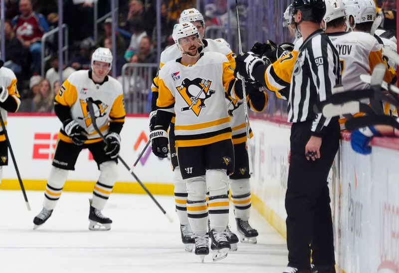 Mar 16, 2026; Denver, Colorado, USA; Pittsburgh Penguins defenseman Erik Karlsson (65) celebrates his goal in the second period against the Colorado Avalanche at Ball Arena. Mandatory Credit: Ron Chenoy-Imagn Images