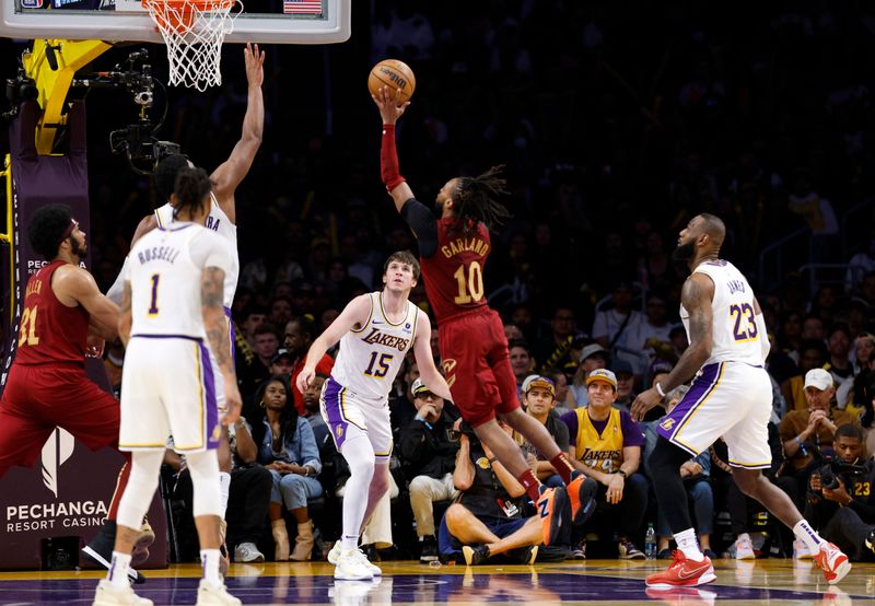 LOS ANGELES, CALIFORNIA - APRIL 6: Darius Garland #10 of the Cleveland Cavaliers scores on floater against Rui Hachimura #28 of the Los Angeles Lakers during the second half at Crypto.com Arena on April 6, 2024 in Los Angeles, California. NOTE TO USER: User expressly acknowledges and agrees that, by downloading and or using this photograph, User is consenting to the terms and conditions of the Getty Images License Agreement. (Photo by Kevork Djansezian/Getty Images)