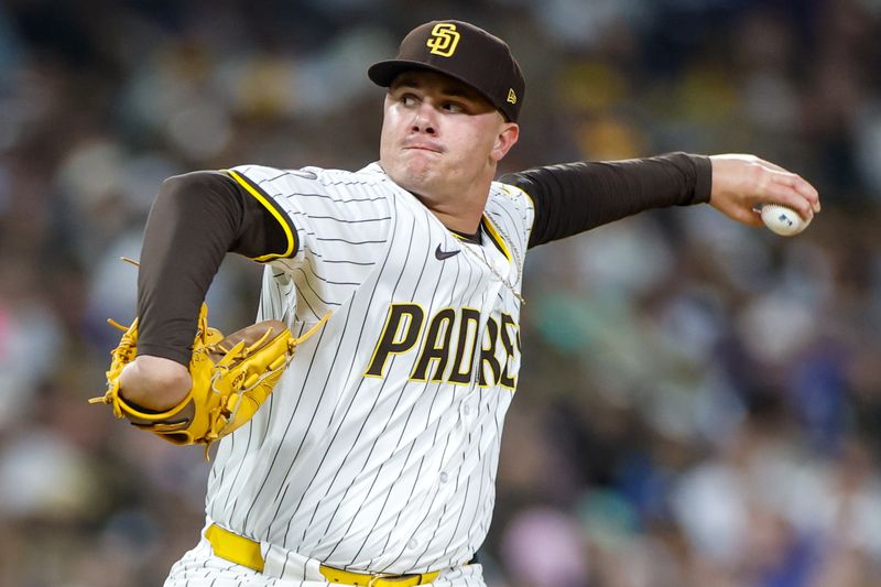 Jun 9, 2025; San Diego, California, USA; San Diego Padres relief pitcher Adrian Morejon (50) throws a pitch during the eighth inning against the Los Angeles Dodgers at Petco Park. Mandatory Credit: David Frerker-Imagn Images