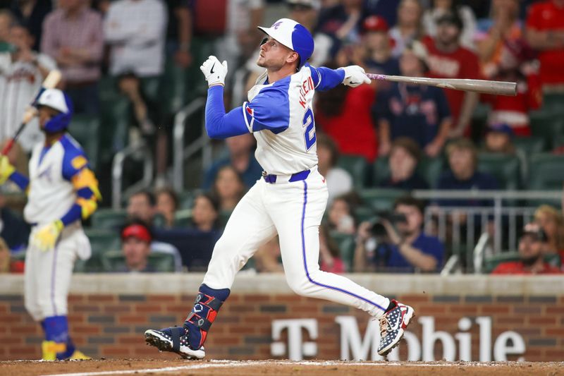 Apr 27, 2024; Atlanta, Georgia, USA; Atlanta Braves left fielder Jarred Kelenic (24) hits a RBI single against the Cleveland Guardians in the eighth inning at Truist Park. Mandatory Credit: Brett Davis-USA TODAY Sports
