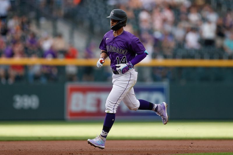 Aug 18, 2023; Denver, Colorado, USA; Colorado Rockies shortstop Ezequiel Tovar (14) rounds the bases on a two run home run in the first inning against the Chicago White Sox at Coors Field. Mandatory Credit: Isaiah J. Downing-USA TODAY Sports