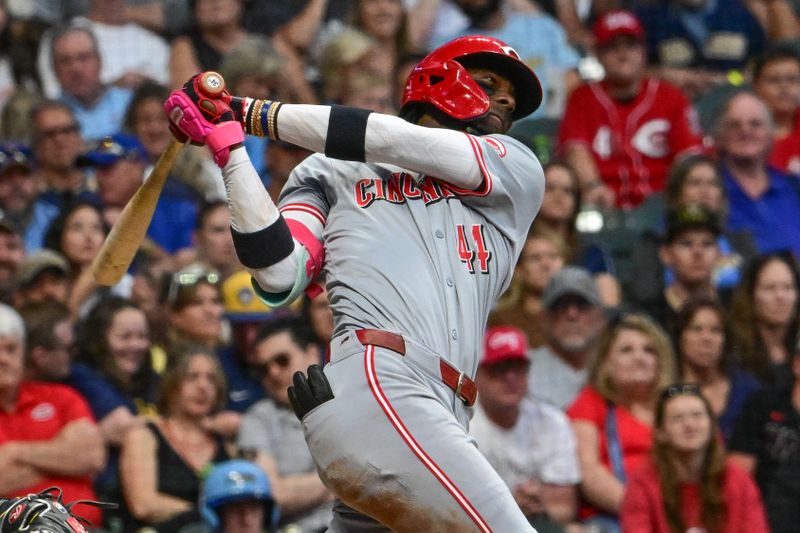 Jun 14, 2024; Milwaukee, Wisconsin, USA;  Cincinnati Reds shortstop Elly De La Cruz (44) hits a triple to drive in a run against the Milwaukee Brewers in the fifth inning at American Family Field. Mandatory Credit: Benny Sieu-USA TODAY Sports