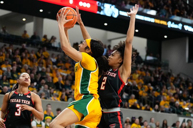 Feb 18, 2024; Waco, Texas, USA;  Baylor Lady Bears guard Darianna Littlepage-Buggs (5) scores a basket against Texas Tech Red Raiders guard Kilah Freelon (2) during the second half at Paul and Alejandra Foster Pavilion. Mandatory Credit: Chris Jones-USA TODAY Sports