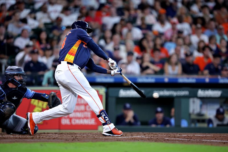 Aug 4, 2024; Houston, Texas, USA; Houston Astros designated hitter Yordan Alvarez (44) hits a single to center field against the Tampa Bay Rays during the third inning at Minute Maid Park. Mandatory Credit: Erik Williams-USA TODAY Sports