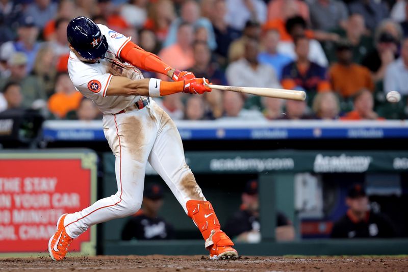 Apr 30, 2025; Houston, Texas, USA; Houston Astros right fielder Cam Smith (11) hits a single against the Detroit Tigers during the seventh inning at Daikin Park. Mandatory Credit: Erik Williams-Imagn Images