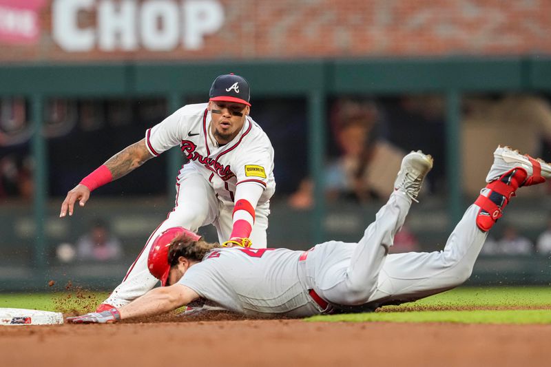 Sep 6, 2023; Cumberland, Georgia, USA; Atlanta Braves shortstop Orlando Arcia (11) tags out St. Louis Cardinals designated hitter Alec Burleson (41) at second base during the first inning at Truist Park. Mandatory Credit: Dale Zanine-USA TODAY Sports