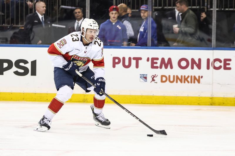 Oct 24, 2024; New York, New York, USA;  Florida Panthers center Carter Verhaeghe (23) controls the puck in the first period against the New York Rangers at Madison Square Garden. Mandatory Credit: Wendell Cruz-Imagn Images