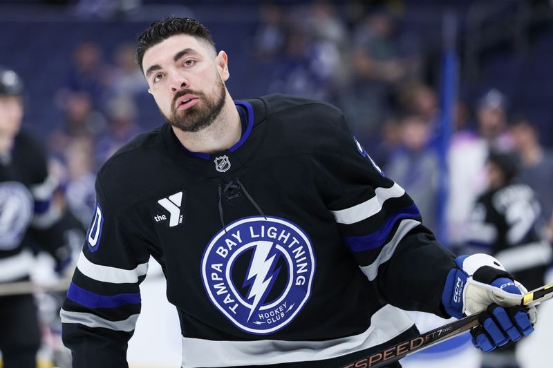 Feb 1, 2025; Tampa, Florida, USA; Tampa Bay Lightning left wing Nick Paul (20) warms up before a game against the New York Islanders at Amalie Arena. Mandatory Credit: Nathan Ray Seebeck-Imagn Images