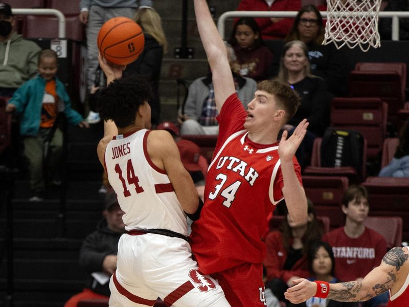 Jan 14, 2024; Stanford, California, USA; Stanford Cardinal forward Spencer Jones (14) shoots around Utah Utes center Lawson Lovering (34) during the first half at Maples Pavilion. Mandatory Credit: D. Ross Cameron-USA TODAY Sports