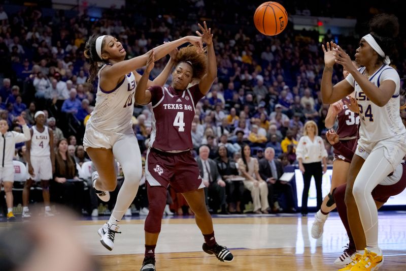 Jan 11, 2024; Baton Rouge, Louisiana, USA; LSU Lady Tigers forward Angel Reese (10) passes to the keep the ball inbounds against Texas A&M Aggies guard Kay Kay Green (4) during the second half at Pete Maravich Assembly Center. Mandatory Credit: Matthew Hinton-USA TODAY Sports