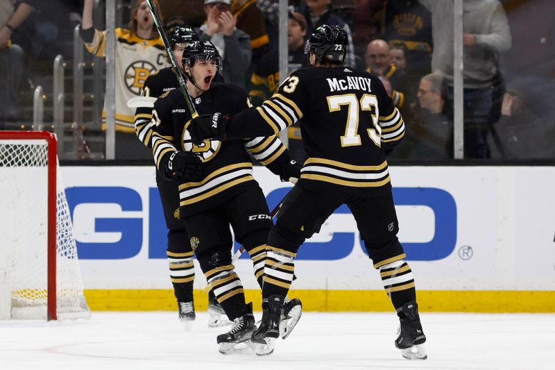 Feb 17, 2024; Boston, Massachusetts, USA; Boston Bruins center Anthony Richard (90) celebrates his goal against the Los Angeles Kings with defenseman Charlie McAvoy (73) during the second period at TD Garden. Mandatory Credit: Winslow Townson-USA TODAY Sports