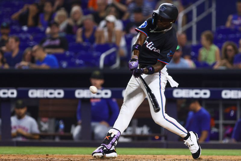 May 17, 2024; Miami, Florida, USA; Miami Marlins center fielder Jazz Chisholm Jr. (2) hits a single against the New York Mets during the eighth inning at loanDepot Park. Mandatory Credit: Sam Navarro-USA TODAY Sports