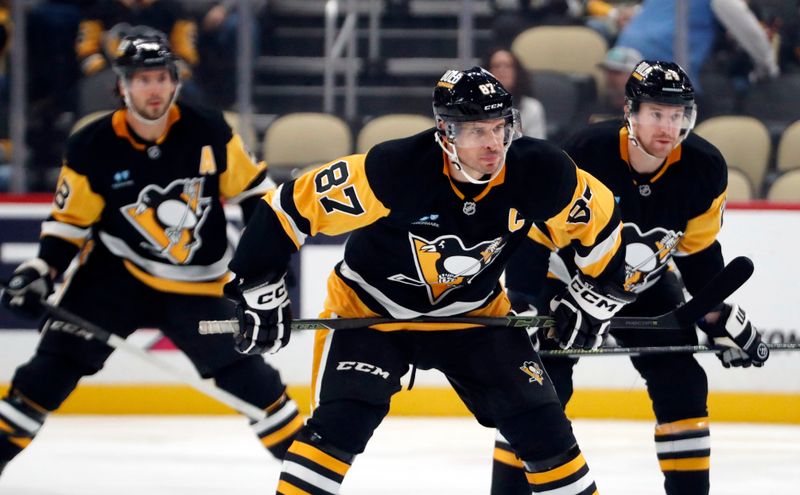 Oct 4, 2024; Pittsburgh, Pennsylvania, USA;  Pittsburgh Penguins center Sidney Crosby (87) prepares for the opening face-off against the Columbus Blue Jackets during the first period at PPG Paints Arena. Mandatory Credit: Charles LeClaire-Imagn Images