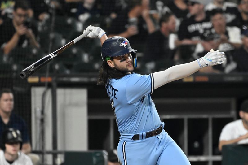 Jul 6, 2023; Chicago, Illinois, USA; Toronto Blue Jays shortstop Bo Bichette (11) hits a single against the Chicago White Sox during the seventh inning  at Guaranteed Rate Field. Mandatory Credit: Matt Marton-USA TODAY Sports