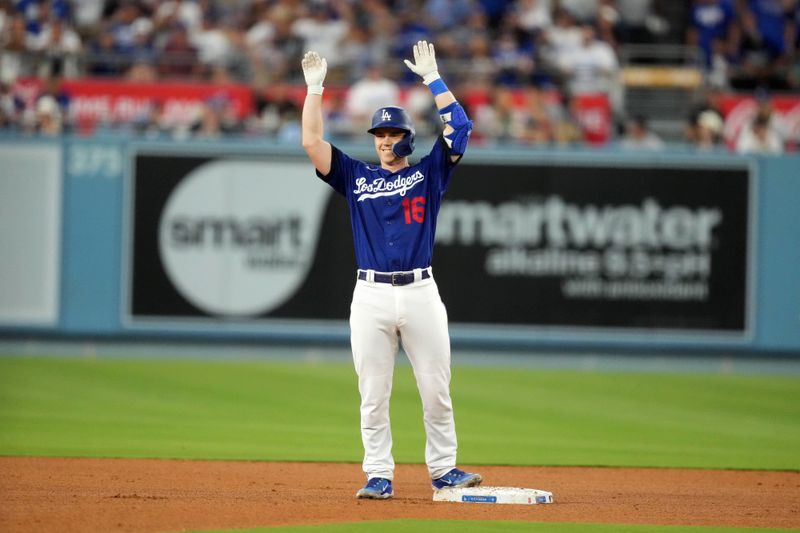 Jul 25, 2023; Los Angeles, California, USA; Los Angeles Dodgers catcher Will Smith (16) celebrates after hitting a double in the third inning against the Toronto Blue Jays at Dodger Stadium. Mandatory Credit: Kirby Lee-USA TODAY Sports