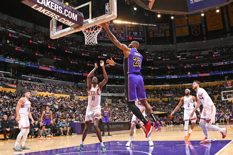 LOS ANGELES, CA - JANUARY 11: LeBron James #23 of the Los Angeles Lakers drives to the basket during the game against the Phoenix Suns on January 11, 2024 at Crypto.Com Arena in Los Angeles, California. NOTE TO USER: User expressly acknowledges and agrees that, by downloading and/or using this Photograph, user is consenting to the terms and conditions of the Getty Images License Agreement. Mandatory Copyright Notice: Copyright 2024 NBAE (Photo by Andrew D. Bernstein/NBAE via Getty Images)