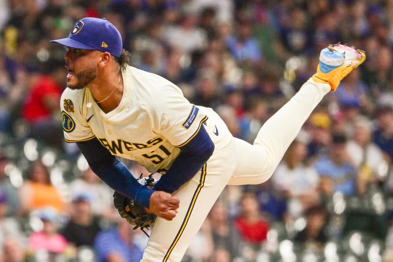 Jun 24, 2025; Milwaukee, Wisconsin, USA; Milwaukee Brewers starting pitcher Freddy Peralta (51) throws a pitch in the first inning against the Pittsburgh Pirates at American Family Field. Mandatory Credit: Benny Sieu-Imagn Images