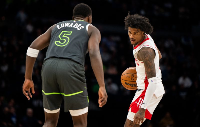 MINNEAPOLIS, MINNESOTA - APRIL 2: Anthony Edwards #5 of the Minnesota Timberwolves defends Jalen Green #4 of the Houston Rockets as he dribbles the ball in the second quarter of the game at Target Center on April 2, 2024 in Minneapolis, Minnesota. NOTE TO USER: User expressly acknowledges and agrees that, by downloading and or using this photograph, User is consenting to the terms and conditions of the Getty Images License Agreement. (Photo by Stephen Maturen/Getty Images)