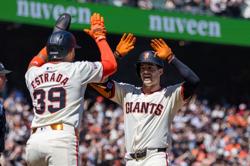 Apr 21, 2024; San Francisco, California, USA;  San Francisco Giants right fielder Mike Yastrzemski (5) is congratulated by second baseman Thairo Estrada (39) after he hit a two-run home run against the Arizona Diamondbacks during the fifth inning at Oracle Park. Mandatory Credit: John Hefti-USA TODAY Sports