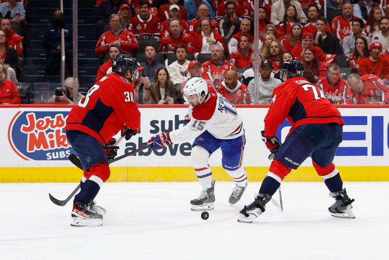 Apr 21, 2025; Washington, District of Columbia, USA; Washington Capitals defenseman Rasmus Sandin (38) blocks the shot of Montreal Canadiens center Alex Newhook (15) in the second period in game one of the first round of the 2025 Stanley Cup Playoffs at Capital One Arena. Mandatory Credit: Geoff Burke-Imagn Images