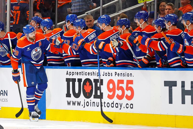 Nov 12, 2024; Edmonton, Alberta, CAN; The Edmonton Oilers celebrate a goal scored by forward Leon Draisaitl (29) during the second period against the New York Islanders at Rogers Place. Mandatory Credit: Perry Nelson-Imagn Images