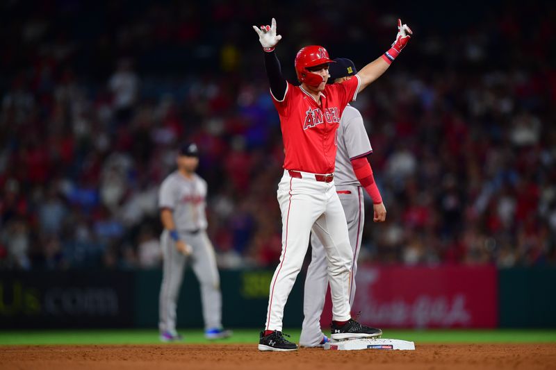 August 16, 2024; Anaheim, California, USA; Los Angeles Angels right fielder Mickey Moniak (16) reacts after hitting an RBI double against the Atlanta Braves during the sixth inning at Angel Stadium. Mandatory Credit: Gary A. Vasquez-USA TODAY Sports