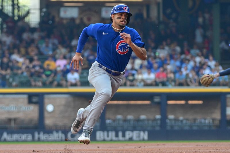 Oct 1, 2023; Milwaukee, Wisconsin, USA; Chicago Cubs shortstop Christopher Morel (5) advances to third base after a single in the first inning against the Milwaukee Brewers  at American Family Field. Mandatory Credit: Benny Sieu-USA TODAY Sports