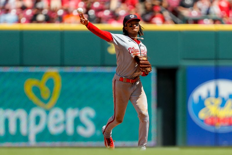 Aug 6, 2023; Cincinnati, Ohio, USA; Washington Nationals shortstop CJ Abrams (5) throws to first to get Cincinnati Reds catcher Tyler Stephenson (not pictured) out in the fourth inning at Great American Ball Park. Mandatory Credit: Katie Stratman-USA TODAY Sports