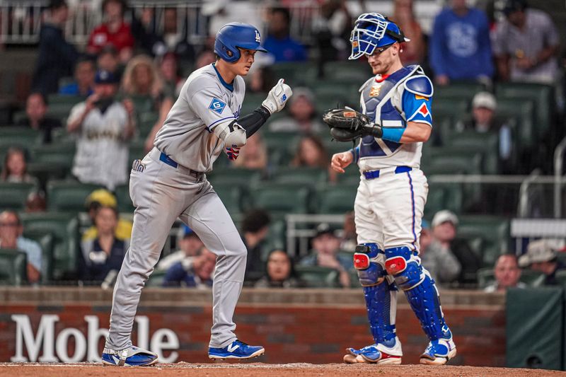 May 3, 2025; Cumberland, Georgia, USA; Los Angeles Dodgers designated hitter Shohei Ohtani (17) reacts after hitting a home run against the Atlanta Braves during the third inning at Truist Park. Mandatory Credit: Dale Zanine-Imagn Images