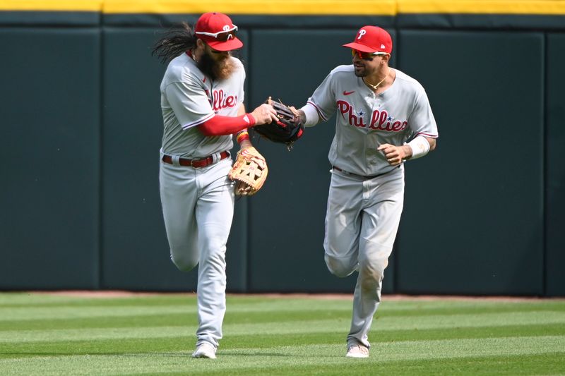 Apr 19, 2023; Chicago, Illinois, USA; Philadelphia Phillies center fielder Brandon Marsh (16) celebrates with Phillies right fielder Nick Castellanos (8) after catching a fly ball hit by Chicago White Sox first baseman Andrew Vaughn (not pictured) during the sixth inning at Guaranteed Rate Field. Mandatory Credit: Matt Marton-USA TODAY Sports