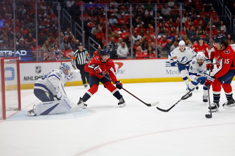 Apr 13, 2024; Washington, District of Columbia, USA; Washington Capitals left wing Sonny Milano (15) scores a goal on Tampa Bay Lightning goaltender Andrei Vasilevskiy (88) in the first period at Capital One Arena. Mandatory Credit: Geoff Burke-USA TODAY Sports