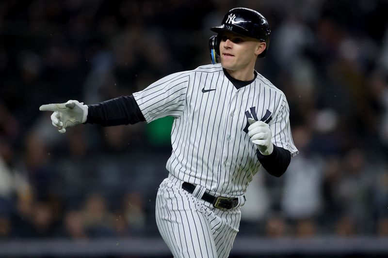 May 3, 2023; Bronx, New York, USA; New York Yankees right fielder Jake Bauers (61) points into the dugout as he rounds the bases after hitting a solo home run against the Cleveland Guardians during the fifth inning at Yankee Stadium. Mandatory Credit: Brad Penner-USA TODAY Sports