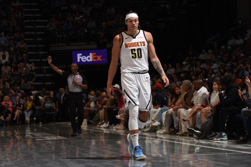 MEMPHIS, TN - APRIL 14:  Aaron Gordon #50 of the Denver Nuggets looks on during the game against the Memphis Grizzlies on April 14, 2024 at FedExForum in Memphis, Tennessee. NOTE TO USER: User expressly acknowledges and agrees that, by downloading and or using this photograph, User is consenting to the terms and conditions of the Getty Images License Agreement. Mandatory Copyright Notice: Copyright 2024 NBAE (Photo by Grant Burke/NBAE via Getty Images)