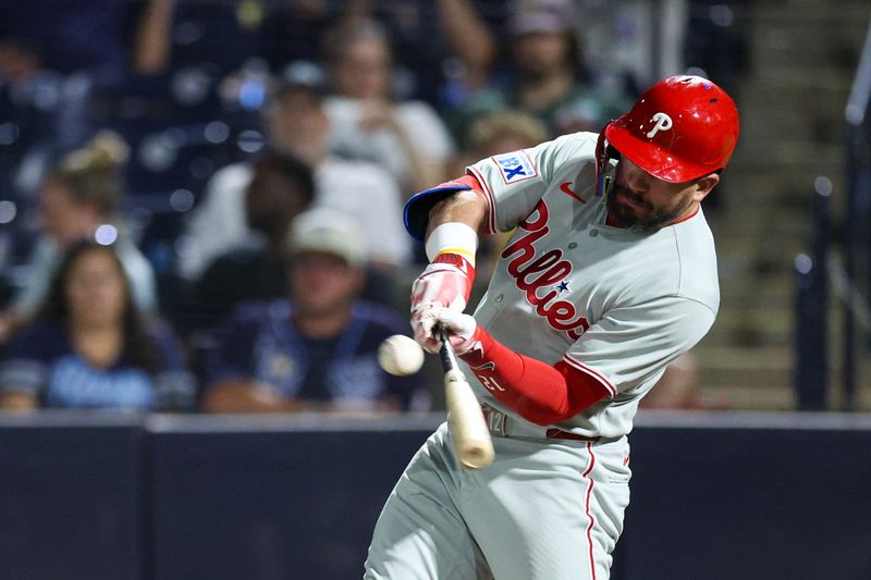 May 6, 2025; Tampa, Florida, USA; Philadelphia Phillies designated hitter Kyle Schwarber (12) hits an rbi single against the Tampa Bay Rays in the eighth inning at George M. Steinbrenner Field. Mandatory Credit: Nathan Ray Seebeck-Imagn Images