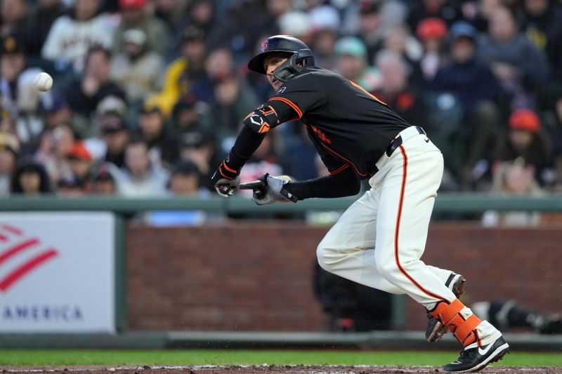 Apr 6, 2024; San Francisco, California, USA; San Francisco Giants shortstop Nick Ahmed (16) runs to first base after bunting for a single against the San Diego Padres during the sixth inning at Oracle Park. Mandatory Credit: Darren Yamashita-USA TODAY Sports