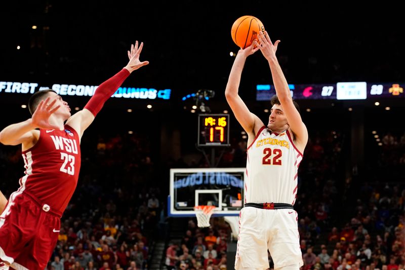 Mar 23, 2024; Omaha, NE, USA; Iowa State Cyclones forward Milan Momcilovic (22) shoots the ball against Washington State Cougars forward Andrej Jakimovski (23) during the second half in the second round of the 2024 NCAA Tournament at CHI Health Center Omaha. Mandatory Credit: Dylan Widger-USA TODAY Sports