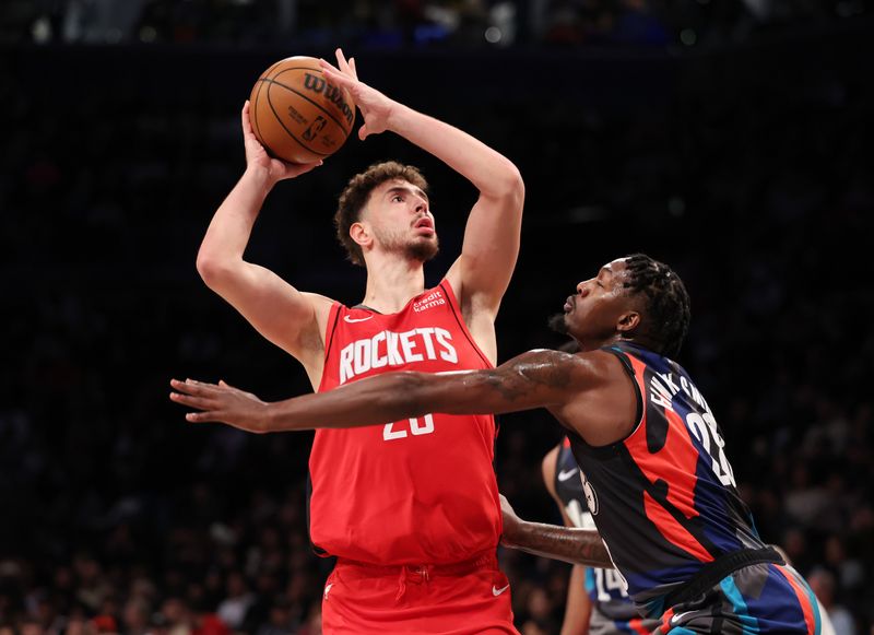 NEW YORK, NEW YORK - JANUARY 27:  Alperen Sengun #28 of the Houston Rockets shoots against Dorian Finney-Smith #28 of the Brooklyn Nets during their game at Barclays Center on January 27, 2024 in New York City.  User expressly acknowledges and agrees that, by downloading and or using this photograph, User is consenting to the terms and conditions of the Getty Images License Agreement.   (Photo by Al Bello/Getty Images)