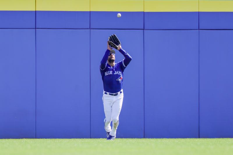 Feb 28, 2023; Dunedin, Florida, USA; Toronto Blue Jays center fielder Kevin Kiermaier (39) catches a fly ball during the third inning against the Detroit Tigers at TD Ballpark. Mandatory Credit: Mike Watters-USA TODAY Sports