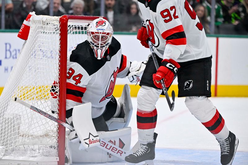 Mar 14, 2024; Dallas, Texas, USA; New Jersey Devils goaltender Jake Allen (34) faces the Dallas Stars attack during the second period at the American Airlines Center. Mandatory Credit: Jerome Miron-USA TODAY Sports