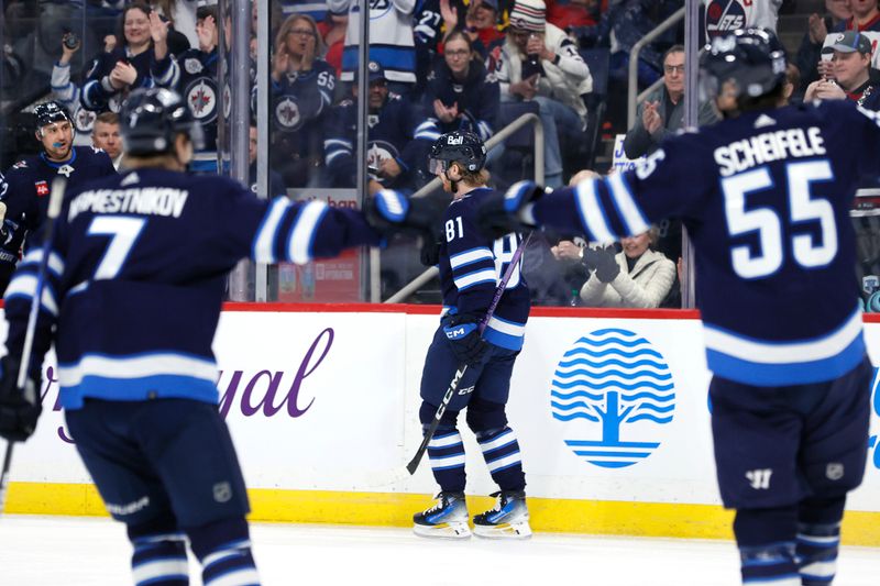 Mar 5, 2024; Winnipeg, Manitoba, CAN; Winnipeg Jets center Vladislav Namestnikov (7) and Winnipeg Jets center Mark Scheifele (55) celebrate the second period goal by Winnipeg Jets left wing Kyle Connor (81) against the Seattle Kraken at Canada Life Centre. Mandatory Credit: James Carey Lauder-USA TODAY Sports