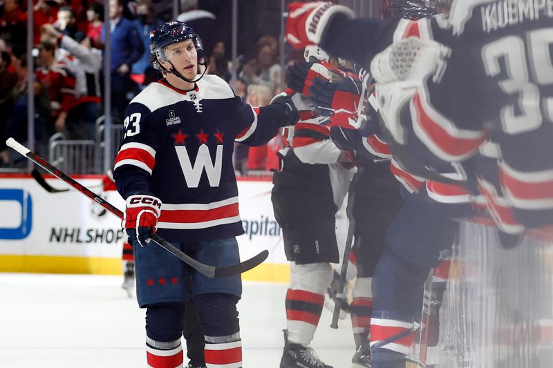 Feb 20, 2024; Washington, District of Columbia, USA; Washington Capitals center Michael Sgarbossa (23) celebrates with teammates after scoring a goal against the New Jersey Devils in the third period at Capital One Arena. Mandatory Credit: Geoff Burke-USA TODAY Sports