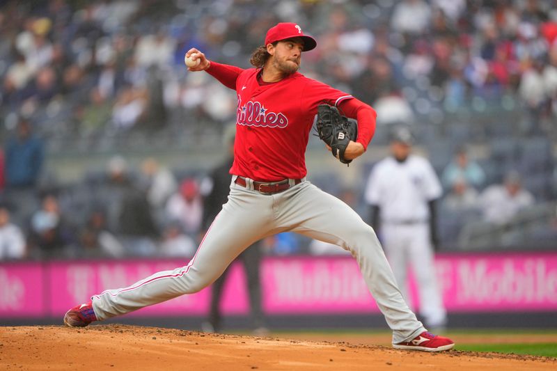 Apr 5, 2023; Bronx, New York, USA; Philadelphia Phillies pitcher Aaron Nola (27) delivers a pitch against the New York Yankees during the first inning at Yankee Stadium. Mandatory Credit: Gregory Fisher-USA TODAY Sports